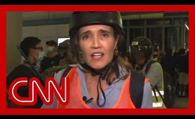 CNN reporter describes 'chaos' as riot police charge protesters
