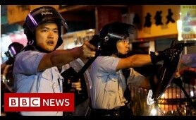 Hong Kong: What led to a single gunshot being fired? - BBC News