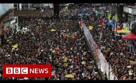 Hong Kong: Police and protesters clash on handover anniversary - BBC News